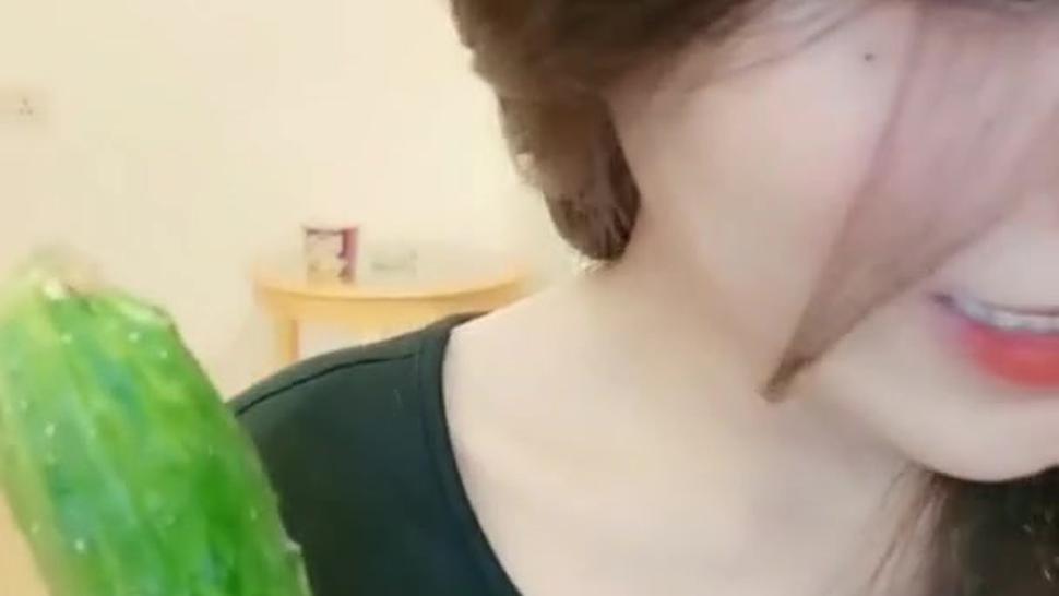 Asian Beautiful girl masturbation by cucumber to sqirt