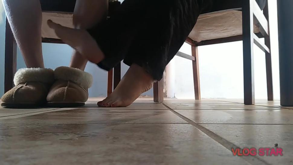 Sexy little feet playing footsie under the table