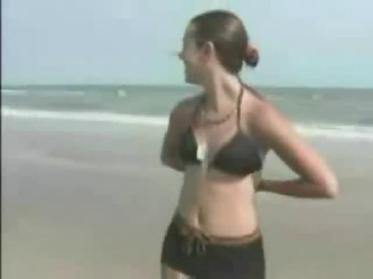 Girl lost bet had to strip on beach