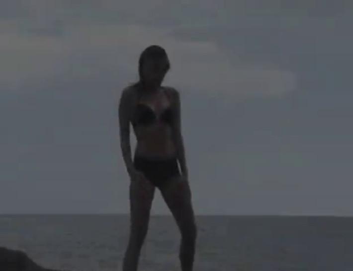 My girl stripping on the beach