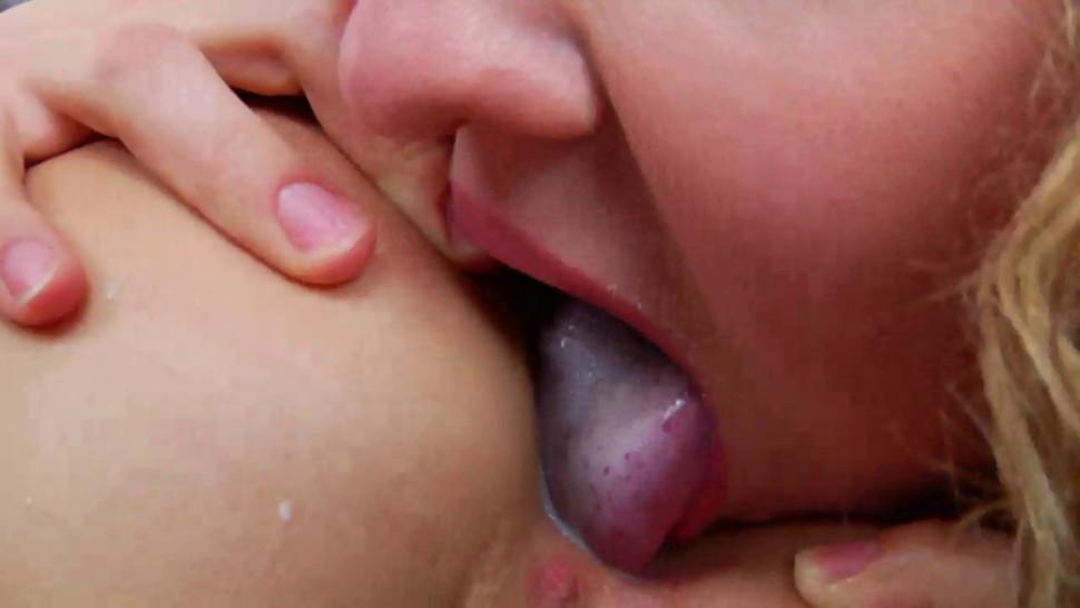 Lolly Moon is squirting milk enema as Isabella C licks it