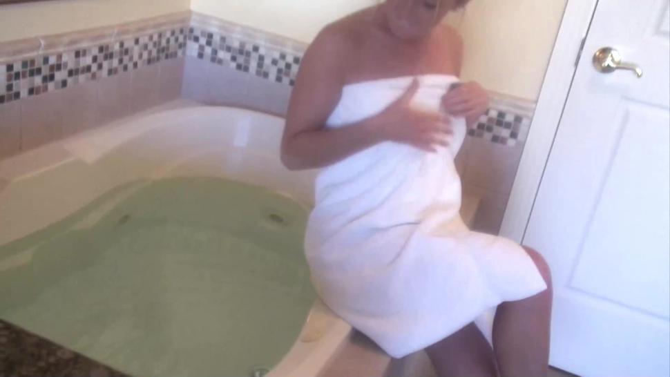 Blonde gf teasing pussy in the bathtub solo