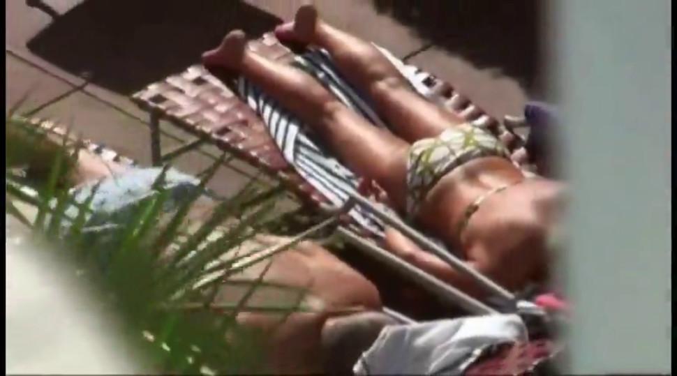 Busty chick is spied on while sunbathing by friend and goes to his room