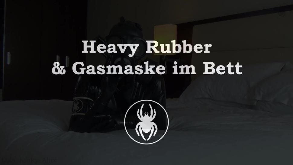 Heavy Rubber And Gas Mask In Bed