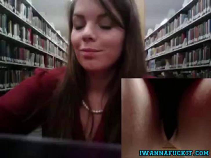 Cute babe toys tight pussy in public library