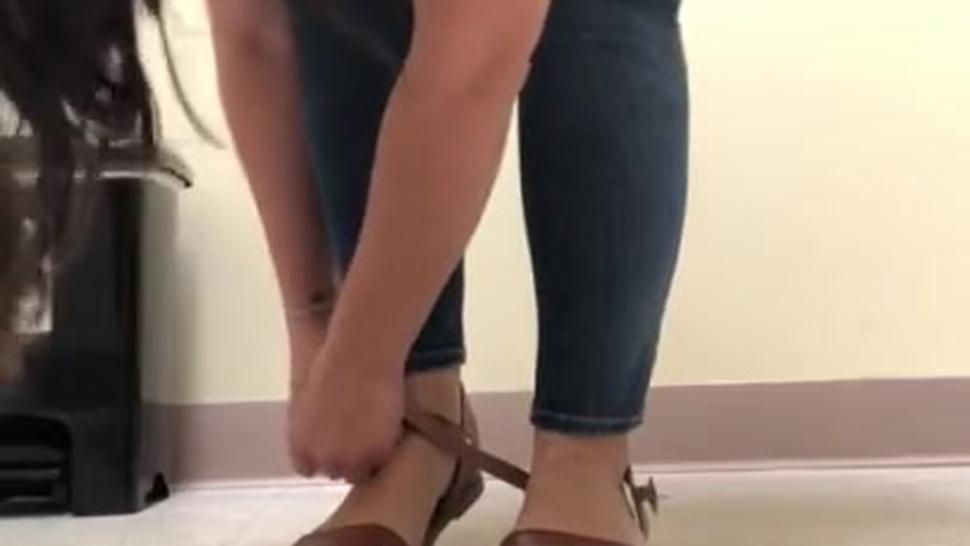 Slut Jackally Leyva showing her smelly soles at work