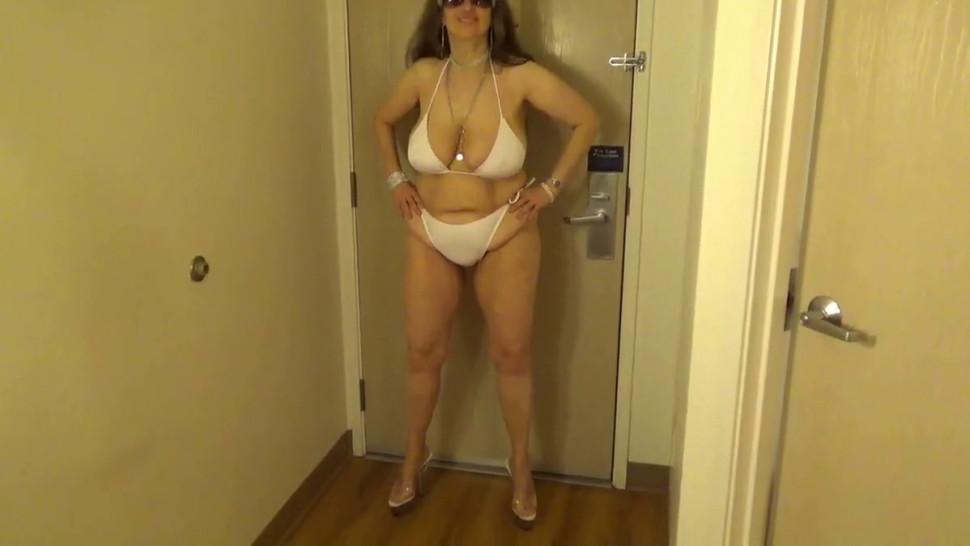 Tinja Stretches A White String Bikini in 6 Inch Stilettos