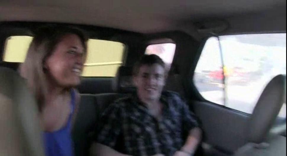 Brunette college beauty giving blowjob to coed in the car