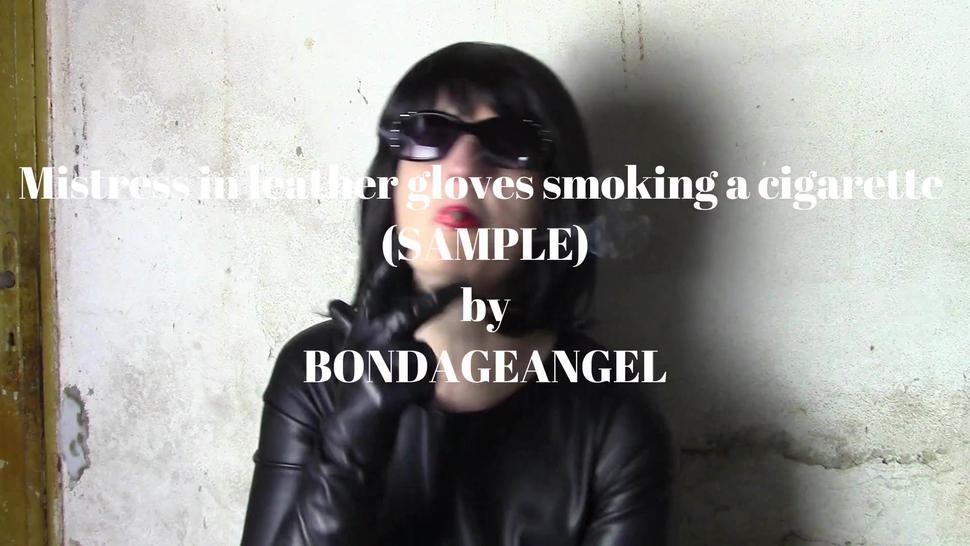 Mistress in leather gloves smoking a cigarette (close-up - SAMPLE)