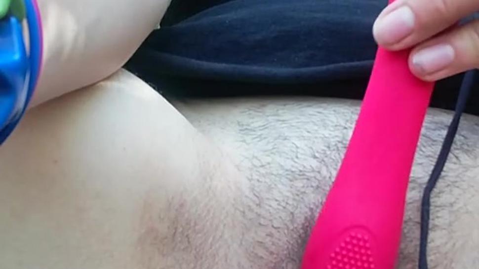 Cumming outside with red toy public outdoors