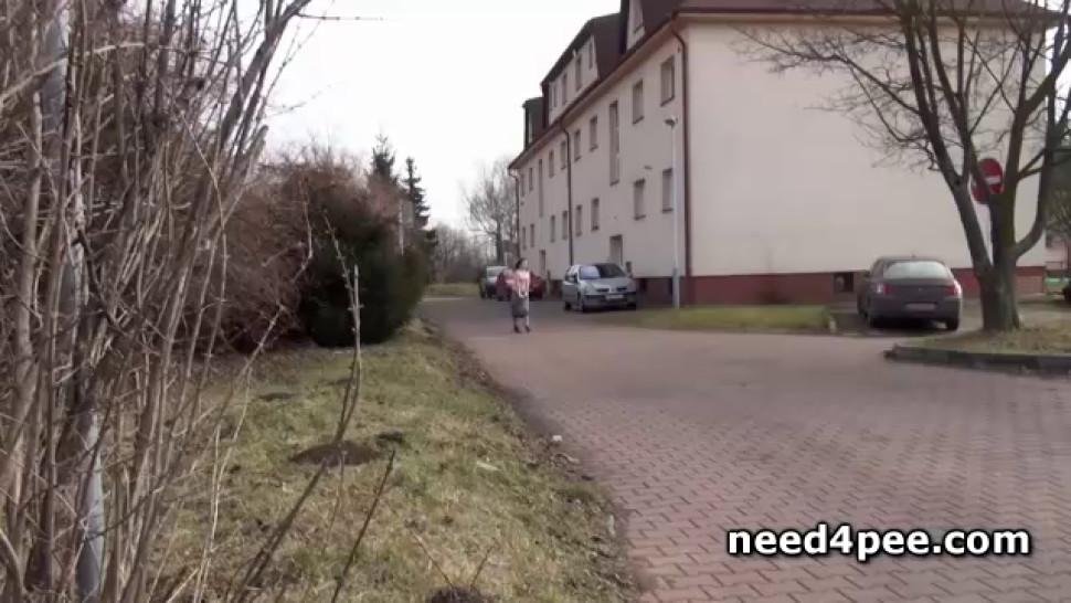 Roller girl squats to piss on the side of the road