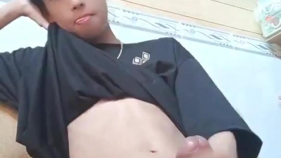 Young Asian boy jerks