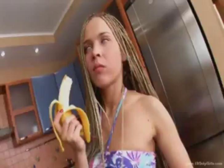 Blonde teenager jilling off with banana