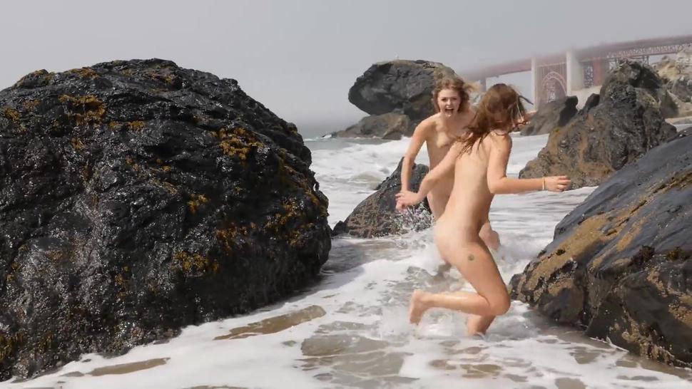 Naked cute girls playing at beach