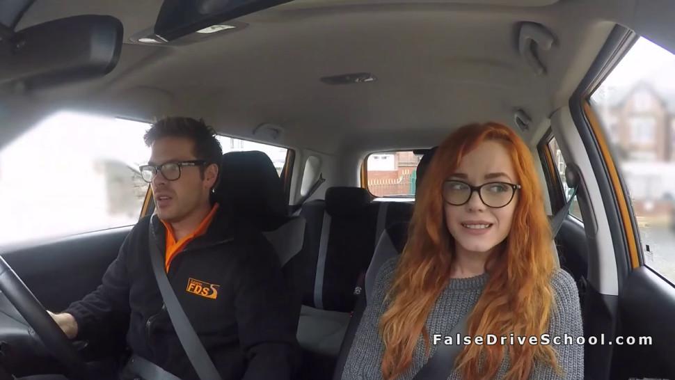 Redhead in threesome in fake driving school