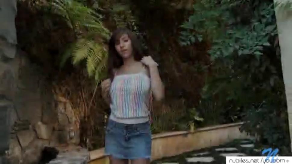 Apirl O'neil strips and plays with her pussy outdoors