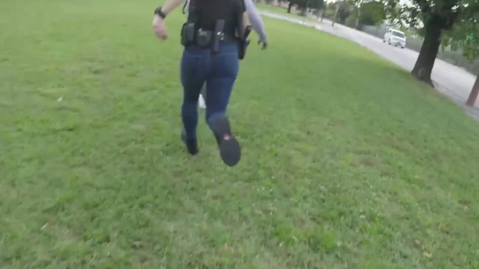 Busty cops enjoy a lot while they suck this huge black penis behind patrol