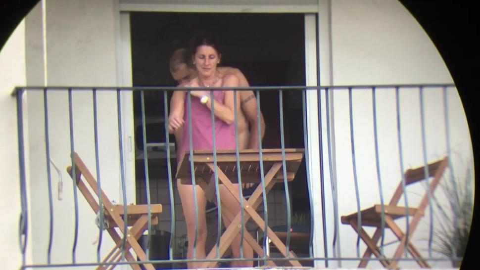 The neighbor gets fucked from all sides on the balcony, exhibitionist, voyeur, public window outside