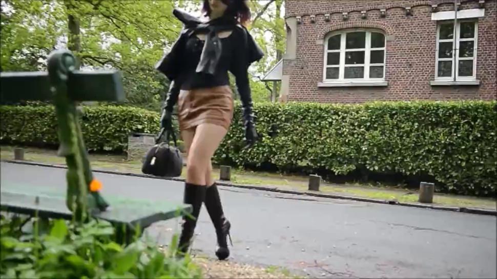 Lady in Leather Gloves and Boots Smoking