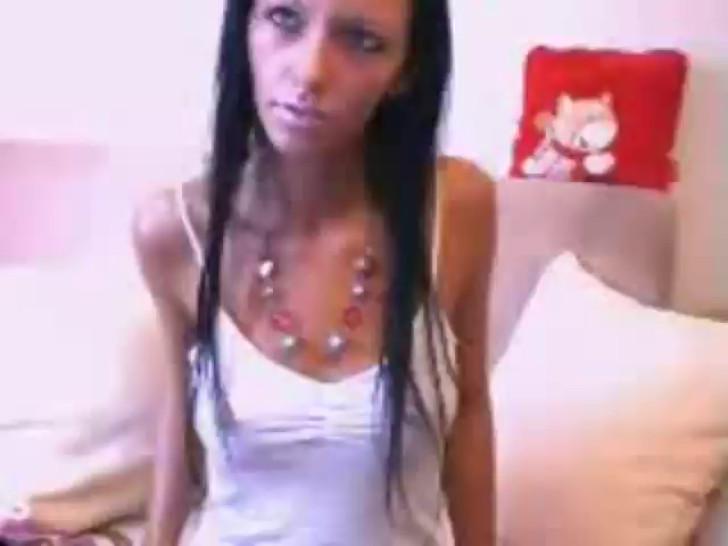 Tight webcam girl playing with her toys