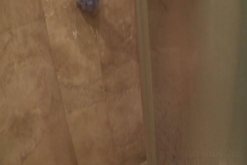 Wet latina shows bald pussy and tits in the shower