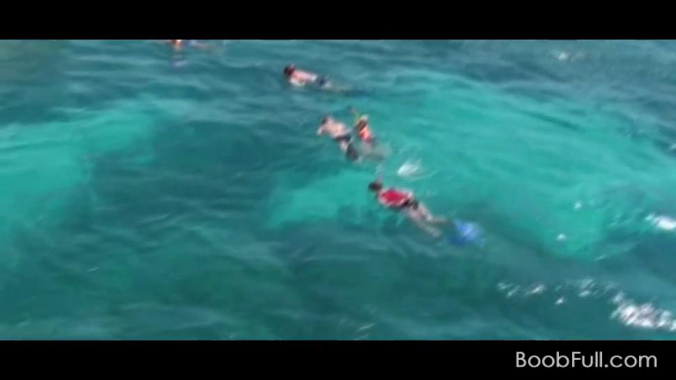 Sexy teen girls in swim suits having fun on a yacht