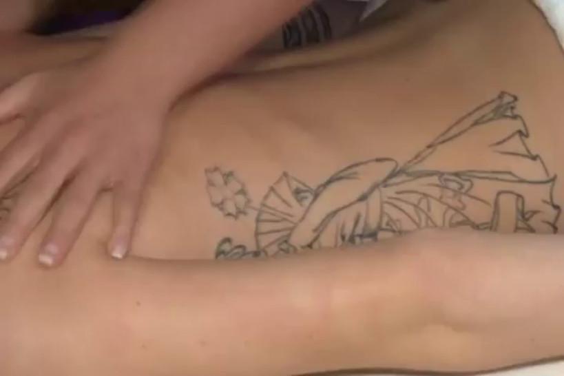 Tattooed babe licks her masseurs nipples