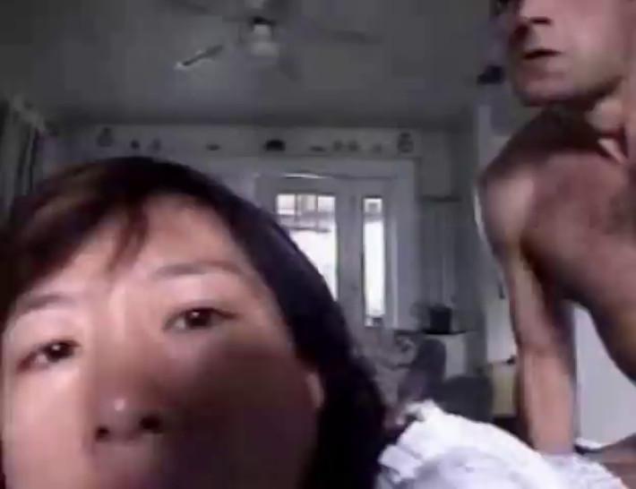 Asian broad stuffs her face with his juicy, veiny cock