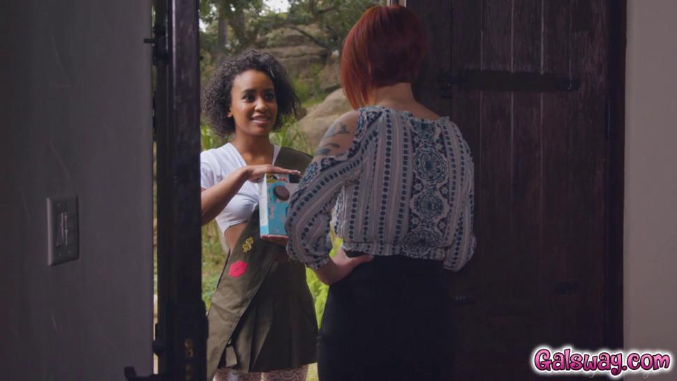 Bree grins as Demi offers her box of cookies and her wet box