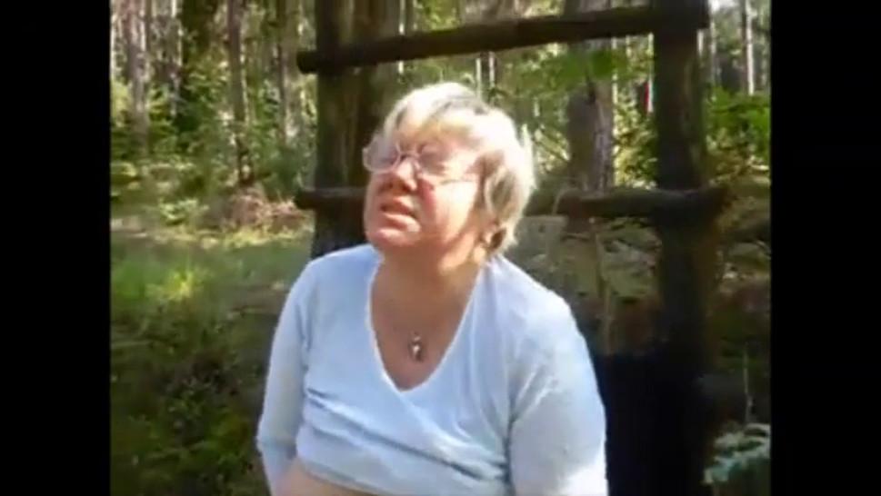 Breasted granny with glasses masturbating in the forest - video 1