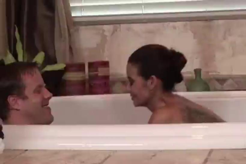 Babe pampering her man in the bathtub