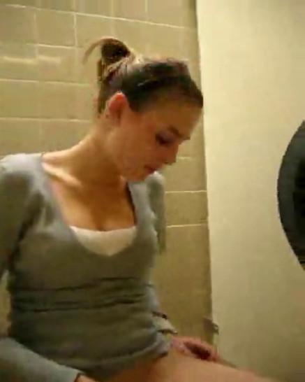 Young girl masturbates in public toilet