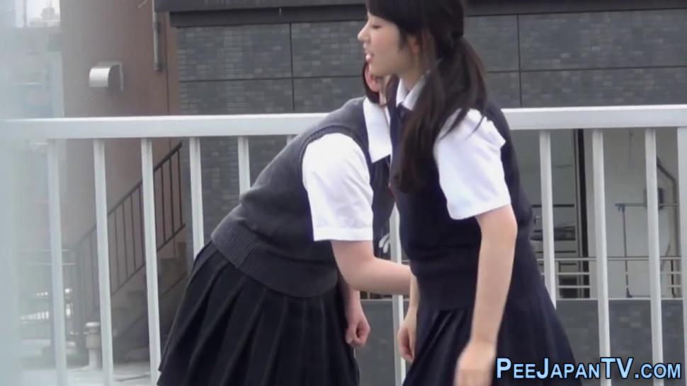 Japanese students pissing outdoors