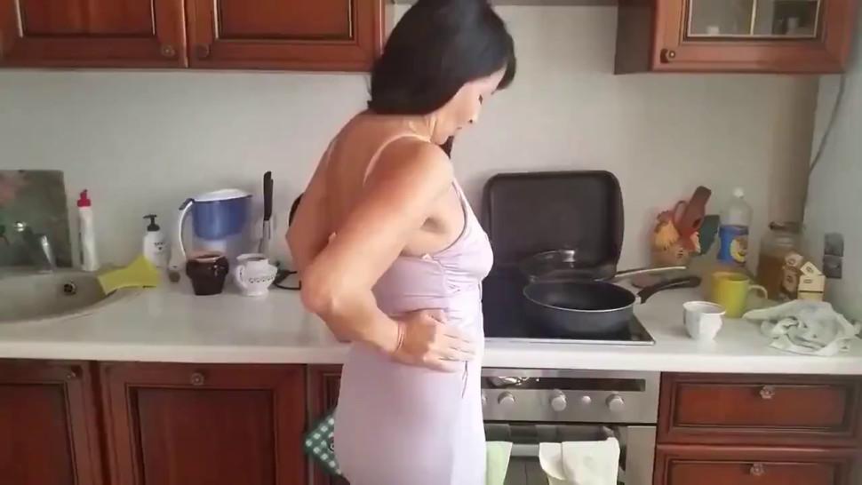 mature_milf_having_fun_with_her_young_neighbor_in_kitchen