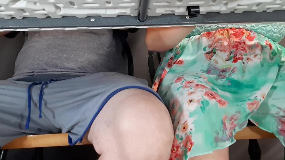 Step mother gives son unwanted handjob at beachside cafe under table