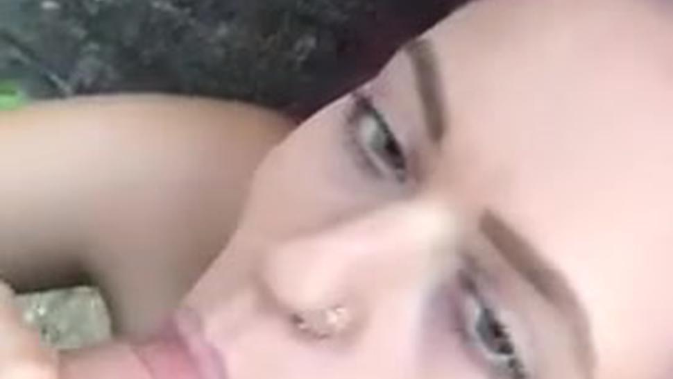 Green eyed pink haired hottie sucking huge dick