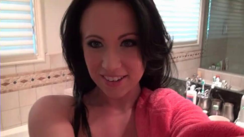 Brunette hottie self fucking with a glass dildo in bathroom