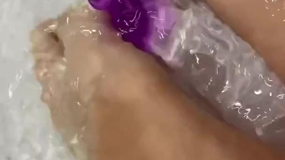 Long toes and ideal feet of pettite boy makes footjob for his dildo under water