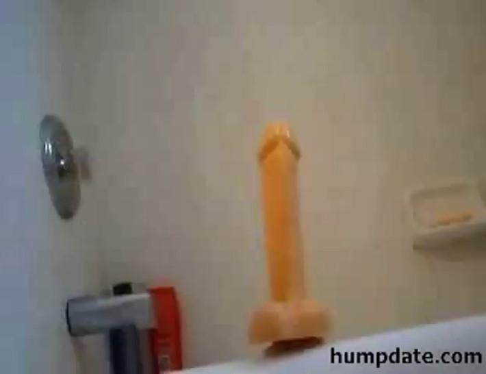 Horny teen rides a huge dildo in her bathtub