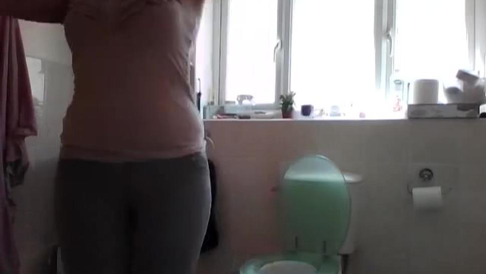 girl pees her pants in the bathoom
