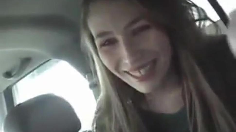 Cute girl gives a blowjob in a car