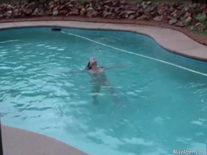 Wife having sex with husband by swimming pool