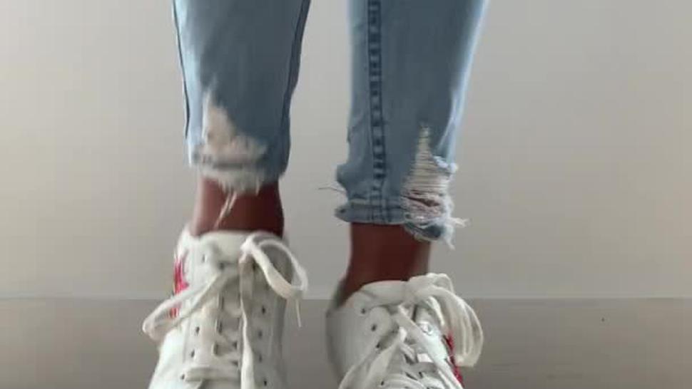 Girl in tight jeans teases you in dirty white sneakers & smelly white socks