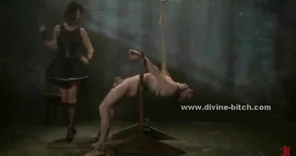 Experienced dominatrix slut whipping man slave tied and immobiliz