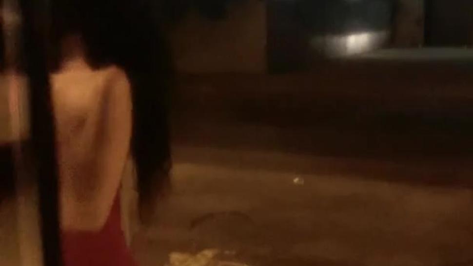Sexy Latina Escort in a tight romper showing off her body and walking up to my door
