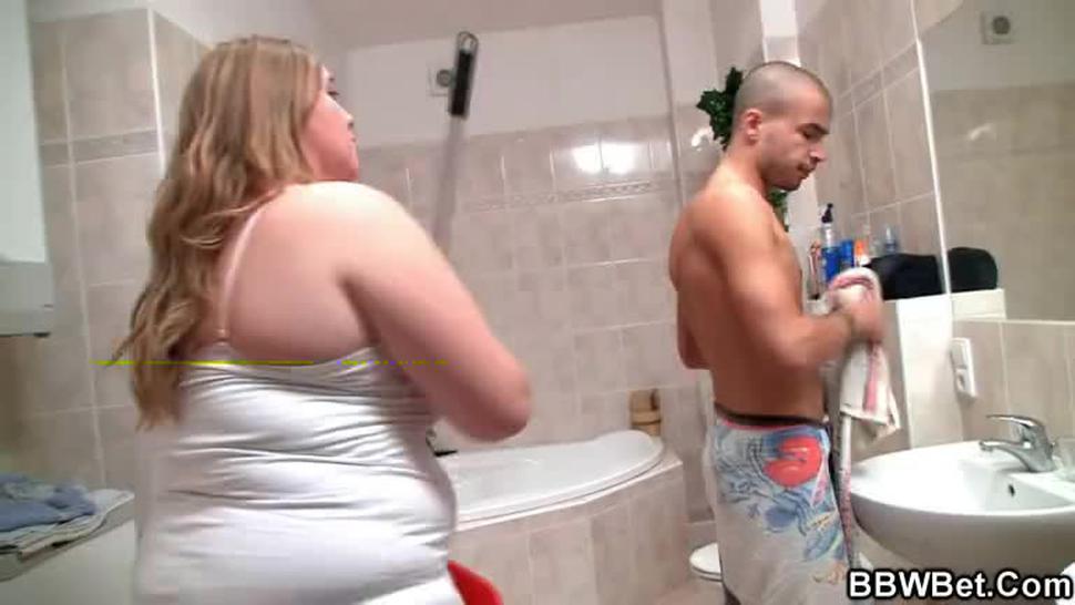 Horny guy fucks busty plumper in the bathroom