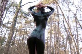 Marilyn yusuf in pink and black latex catsuit in the woods