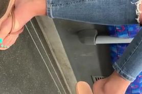 Sexy toes in flip flops on tube