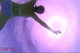 Amazing underwater bikini show. elegant flexible baby swimming underwater in the pool