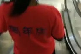 public Cum spray on Asian Escalator girl